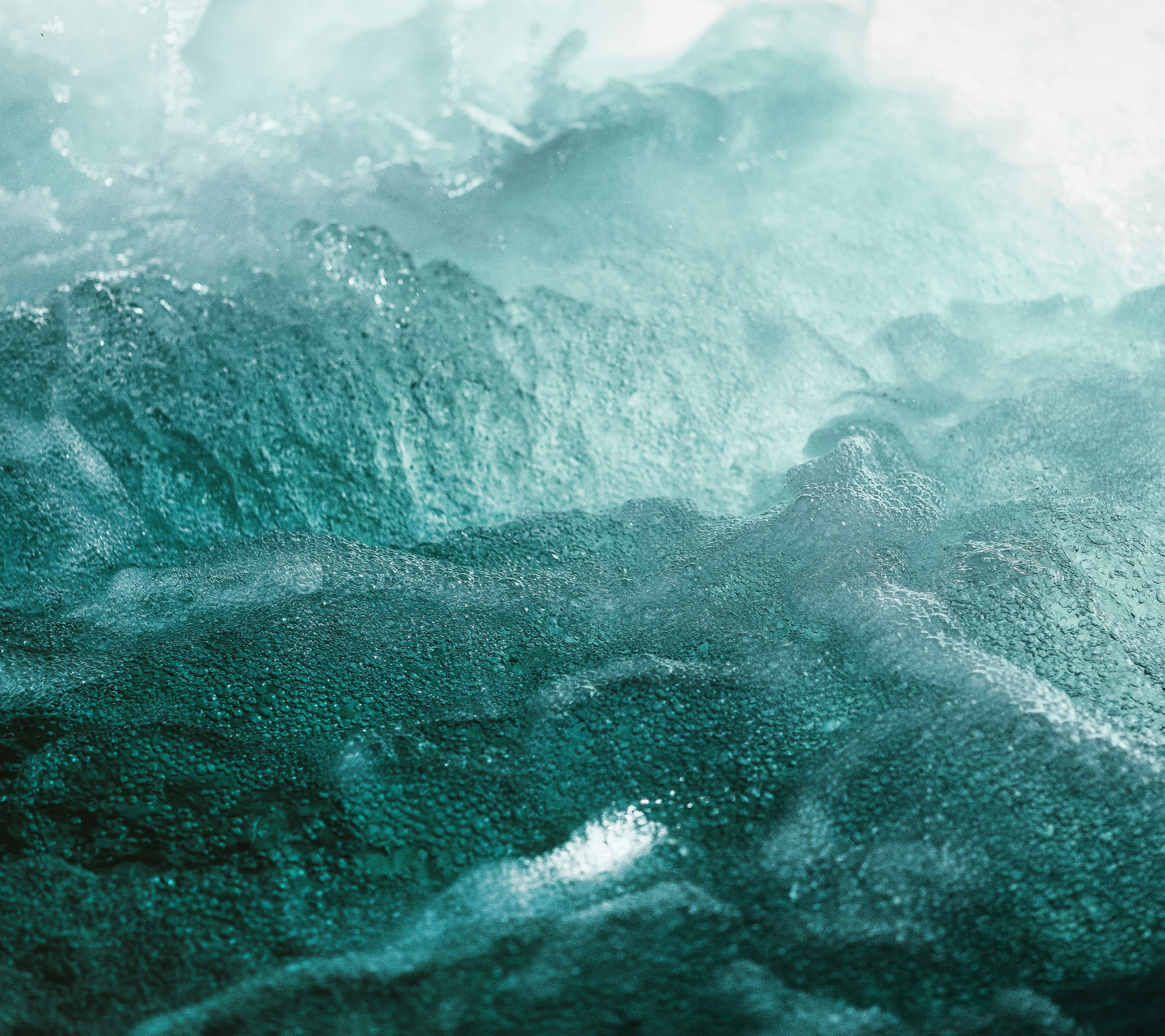 Bird's eye view of a mountain range with a green filter