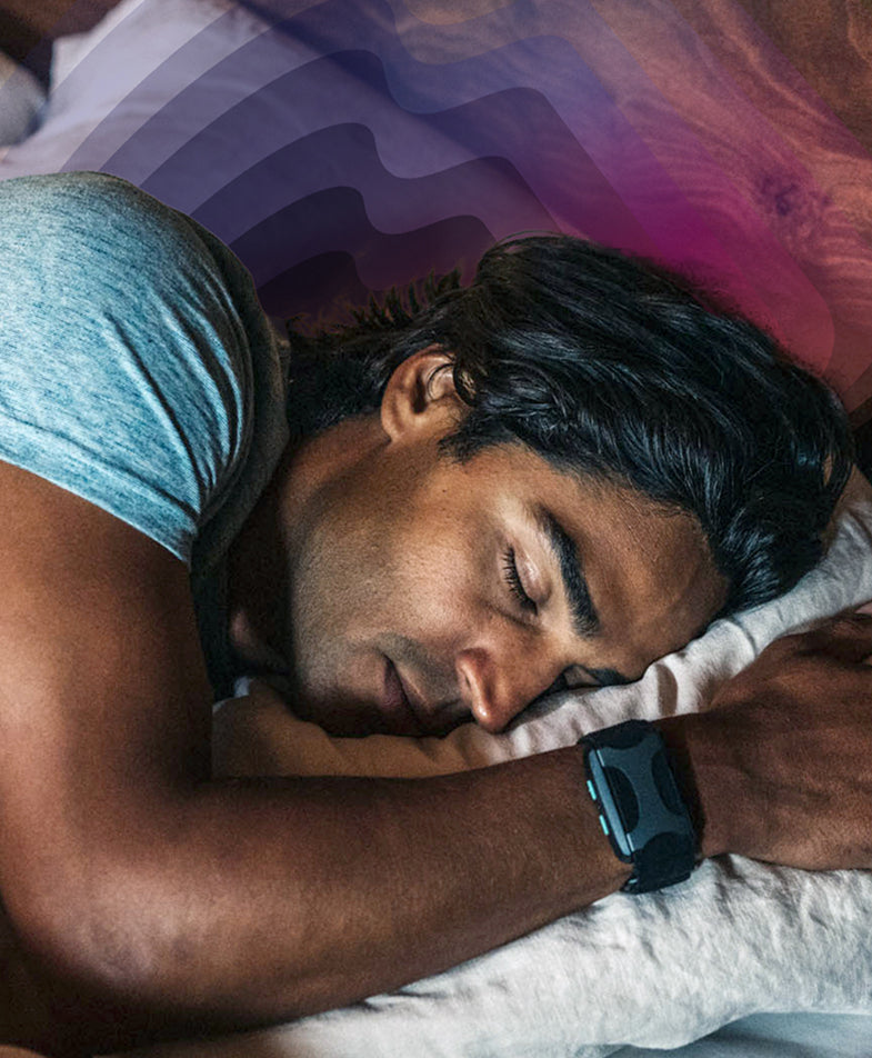man sleeping with apollo wearable on wrist