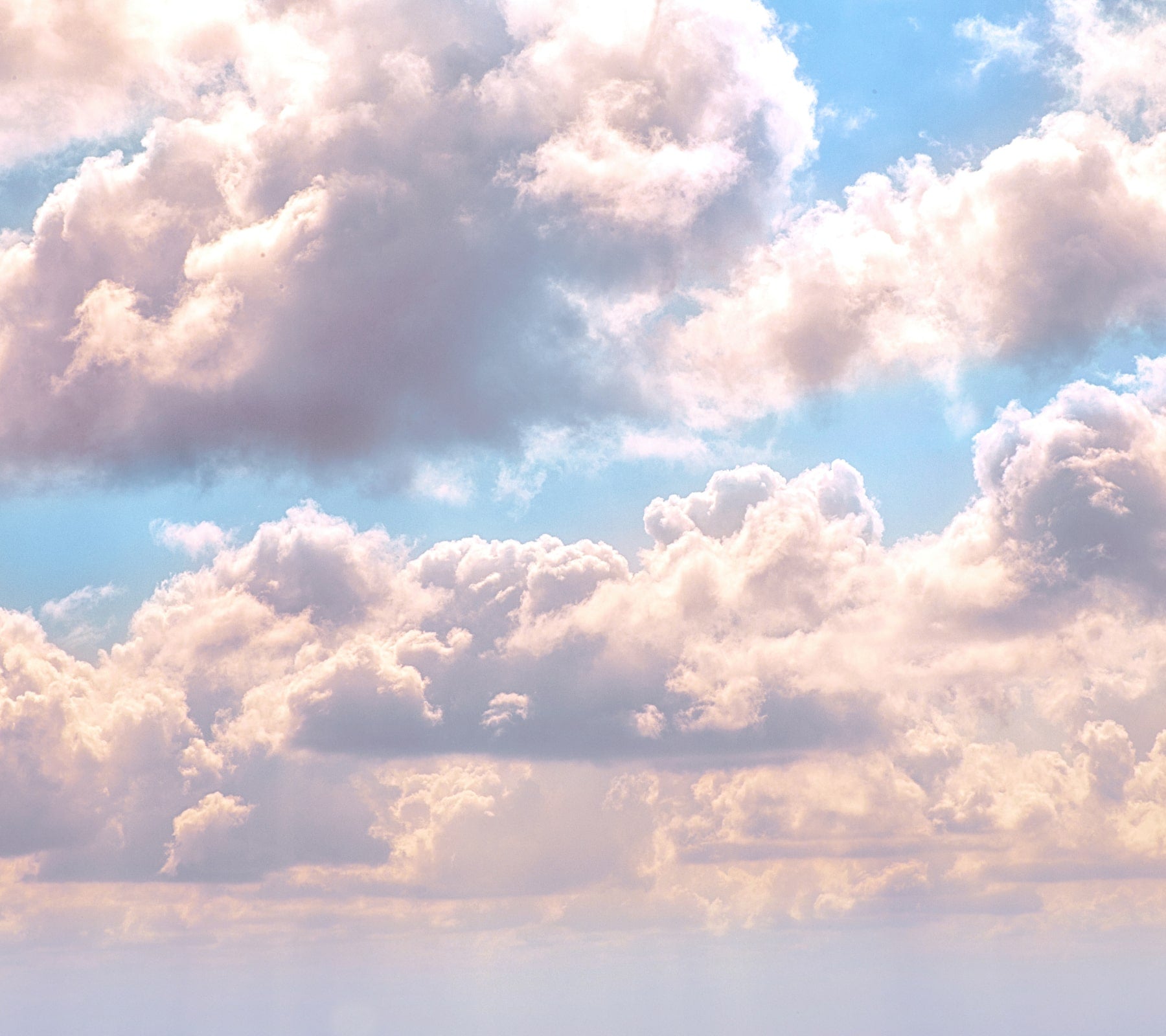 Light blue sky with big white billowy clouds