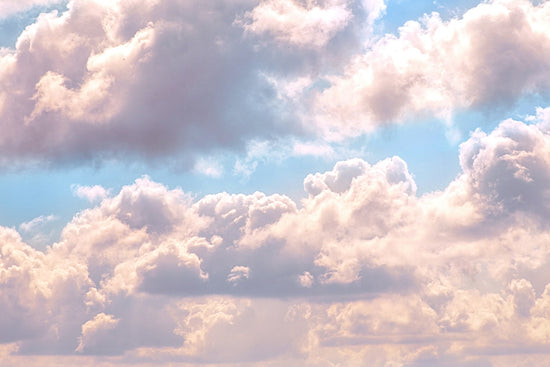 Light blue sky with big white billowy clouds